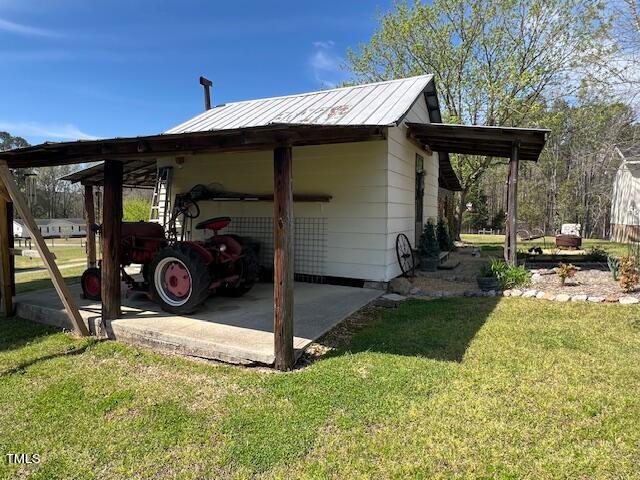 663 Fleming Road Coats, NC 27521 - Photo 26 of 42 a view of a house with backyard and porch