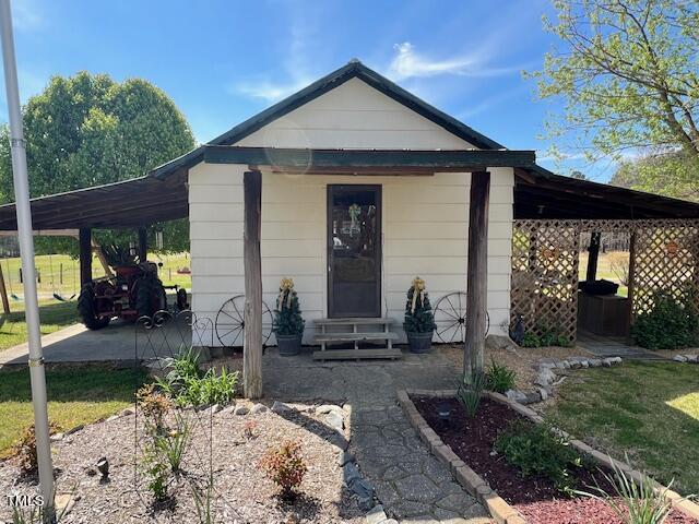 663 Fleming Road Coats, NC 27521 - Photo 27 of 42 a front view of a house with garden