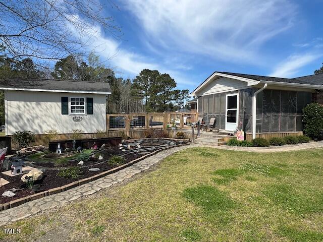 663 Fleming Road Coats, NC 27521 - Photo 30 of 42 a view of house with yard outdoor seating area