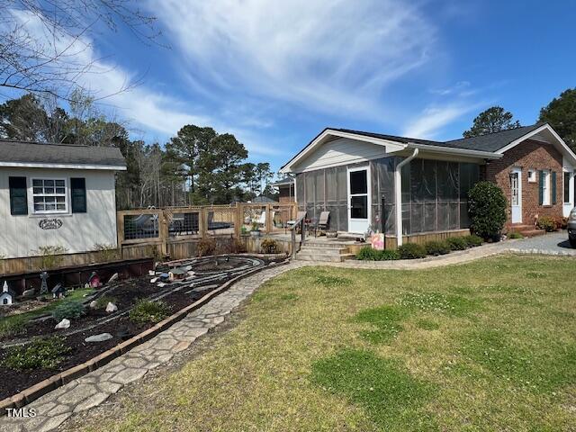 663 Fleming Road Coats, NC 27521 - Photo 31 of 42 a view of a house with swimming pool and furniture