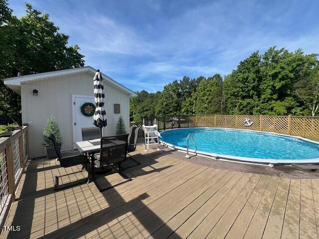 663 Fleming Road Coats, NC 27521 - Photo 33 of 42 a view of a swimming pool with lounge chair