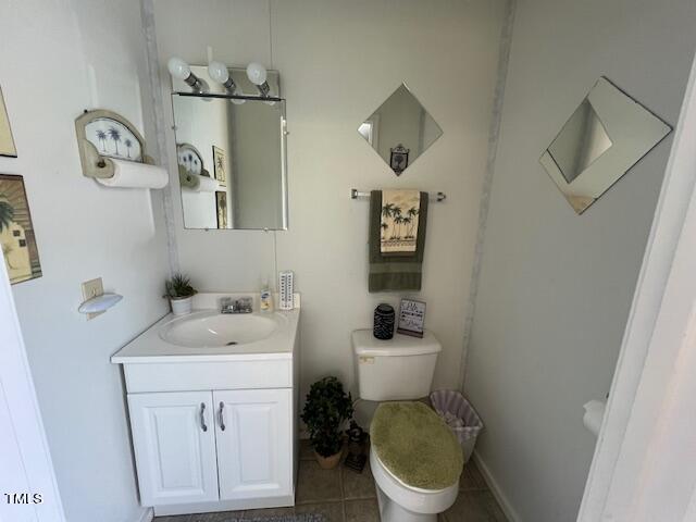 663 Fleming Road Coats, NC 27521 - Photo 36 of 42 a bathroom with a toilet sink and mirror