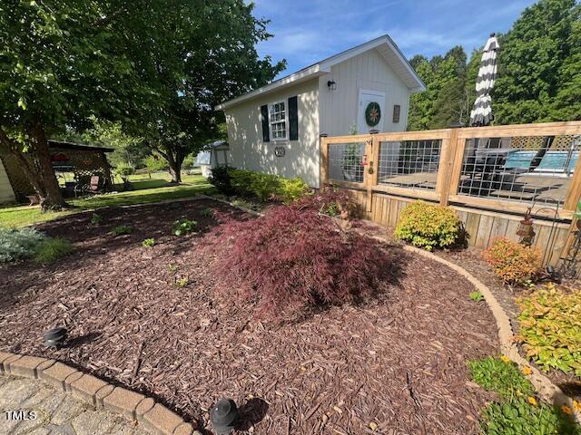663 Fleming Road Coats, NC 27521 - Photo 38 of 42 a front view of a house with a yard