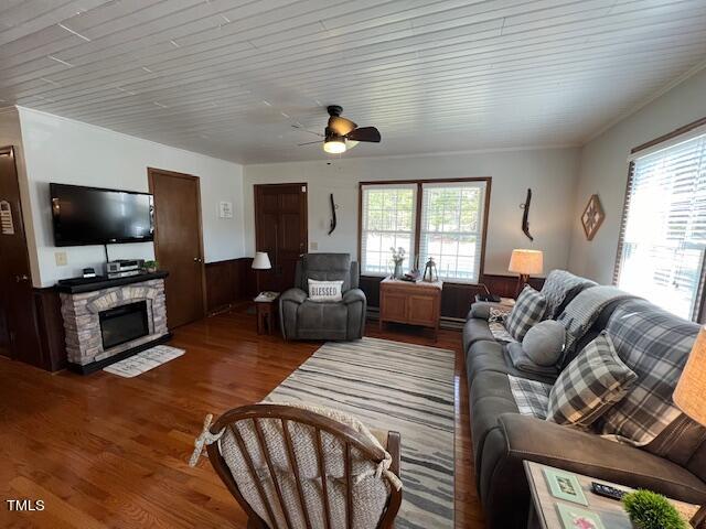 663 Fleming Road Coats, NC 27521 - Photo 4 of 42 a living room with furniture a flat screen tv and a large window