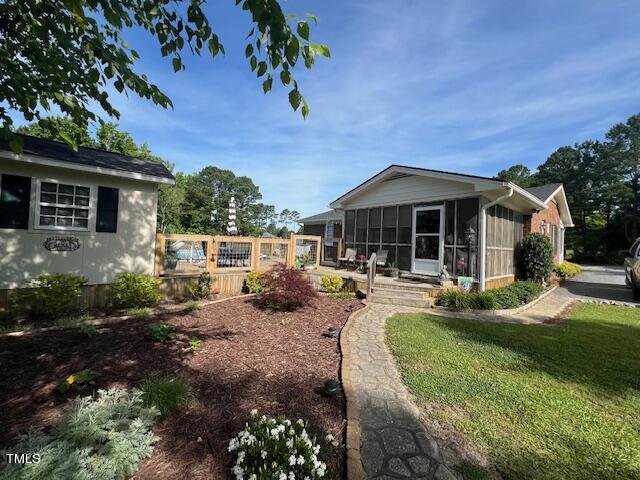 663 Fleming Road Coats, NC 27521 - Photo 42 of 42 a front view of a house with garden