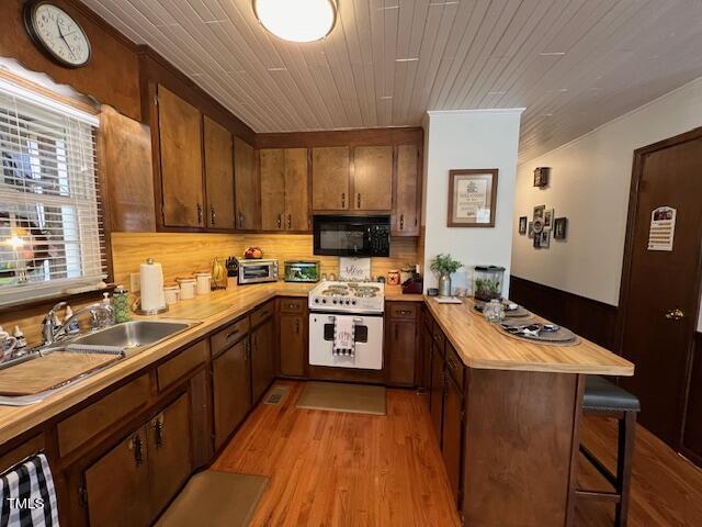 663 Fleming Road Coats, NC 27521 - Photo 6 of 42 a kitchen with stainless steel appliances granite countertop a sink stove and refrigerator