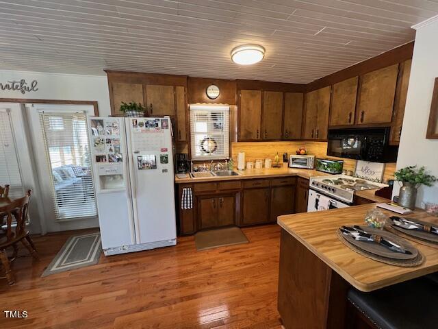 663 Fleming Road Coats, NC 27521 - Photo 8 of 42 a kitchen with stainless steel appliances granite countertop a refrigerator stove sink and dishwasher