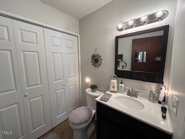 663 Fleming Road Coats, NC 27521 - Photo 10 of 42 a bathroom with a toilet sink and mirror