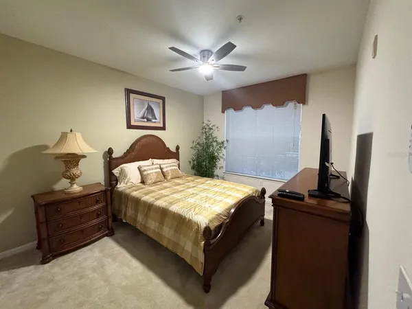 a bedroom with bed and window