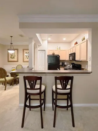 a kitchen with a table and chairs in it
