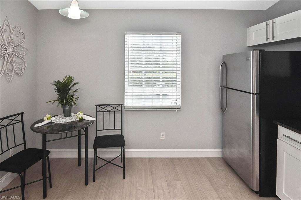 8075 Tiger Cove, Unit 1711 Naples, FL 34113 - Photo 20 of 42 a view of a workspace with furniture and a window