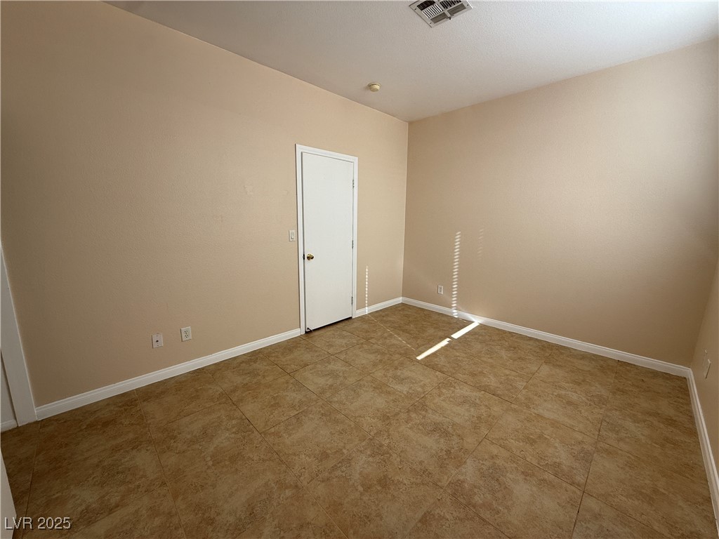 9950 Shadow Grove Avenue Las Vegas, NV 89148 - Photo 16 of 37 Spare room featuring baseboards