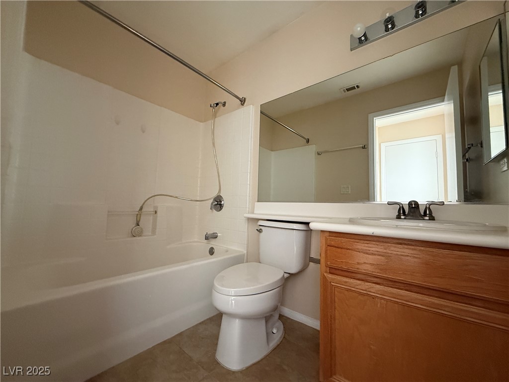 9950 Shadow Grove Avenue Las Vegas, NV 89148 - Photo 17 of 37 Full bathroom featuring bathing tub / shower combination, vanity, and light tile patterned flooring