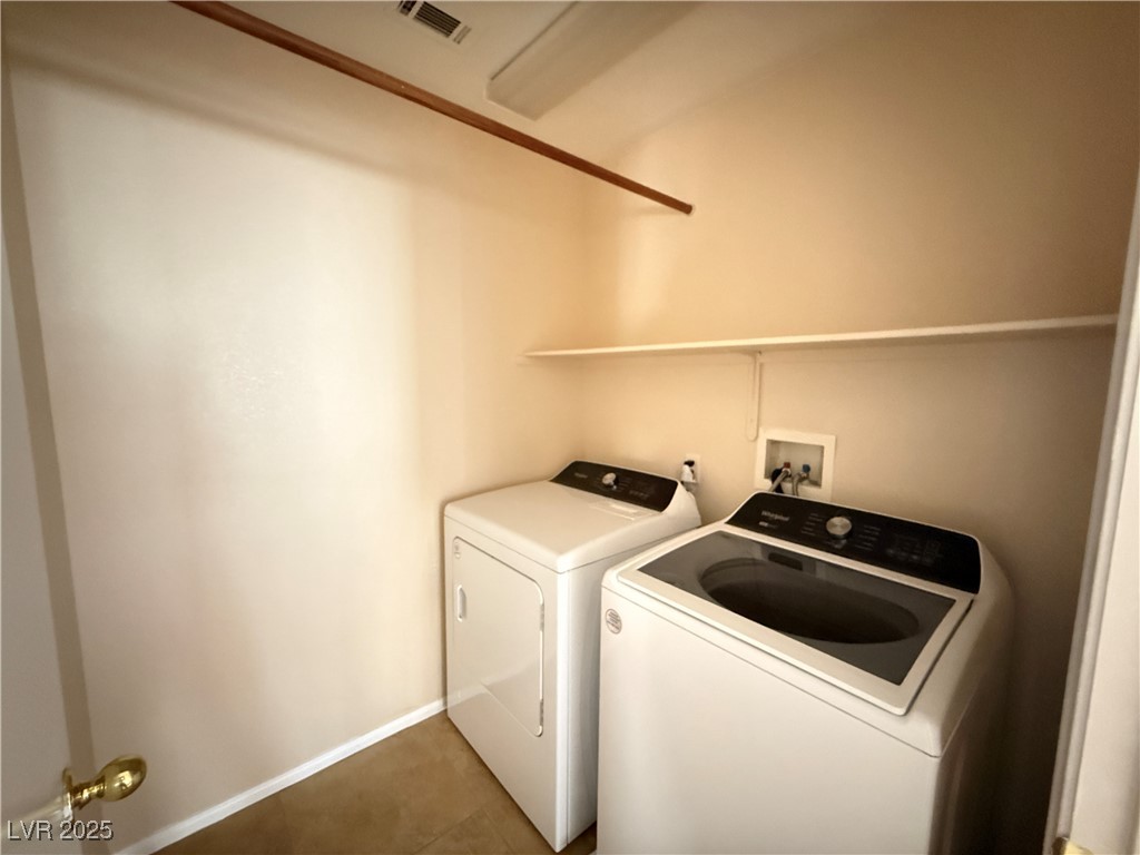 9950 Shadow Grove Avenue Las Vegas, NV 89148 - Photo 24 of 37 Washroom featuring tile patterned floors and washer and dryer