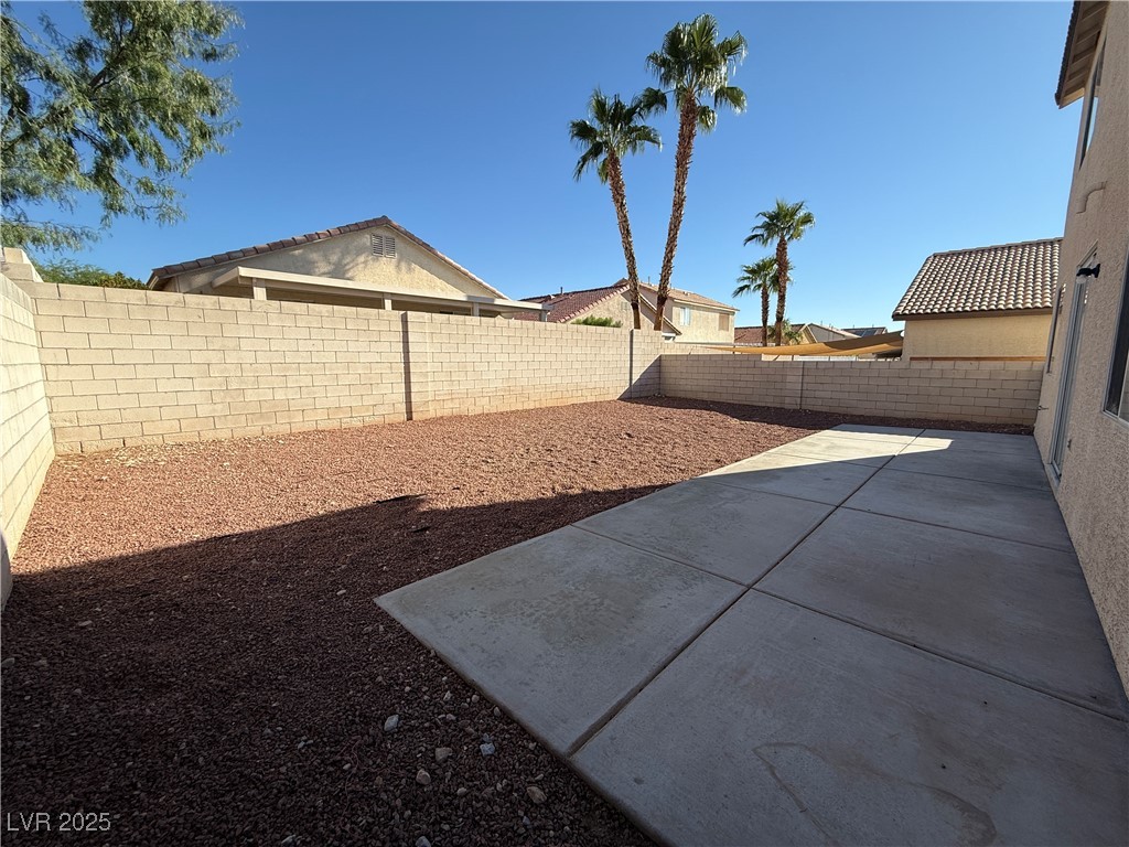9950 Shadow Grove Avenue Las Vegas, NV 89148 - Photo 35 of 37 Fenced backyard with a patio area