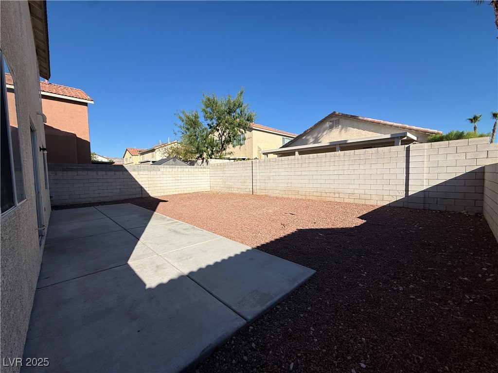 9950 Shadow Grove Avenue Las Vegas, NV 89148 - Photo 36 of 37 Fenced backyard with a patio area