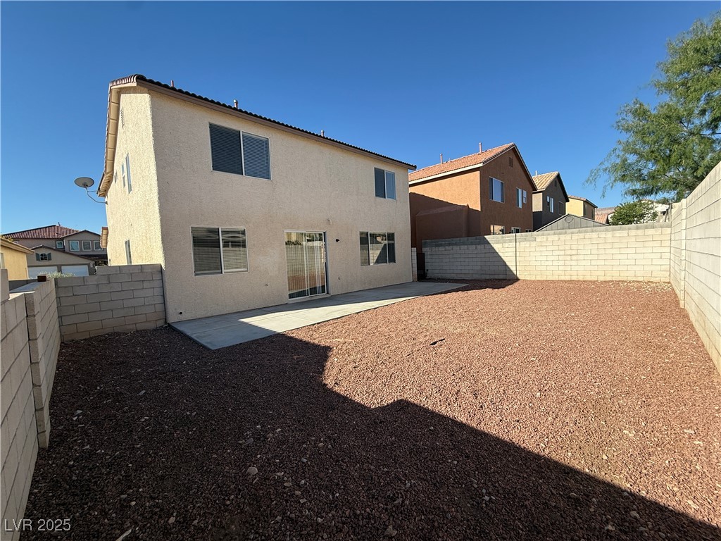 9950 Shadow Grove Avenue Las Vegas, NV 89148 - Photo 37 of 37 Back of property featuring a patio area, a fenced backyard, and stucco siding