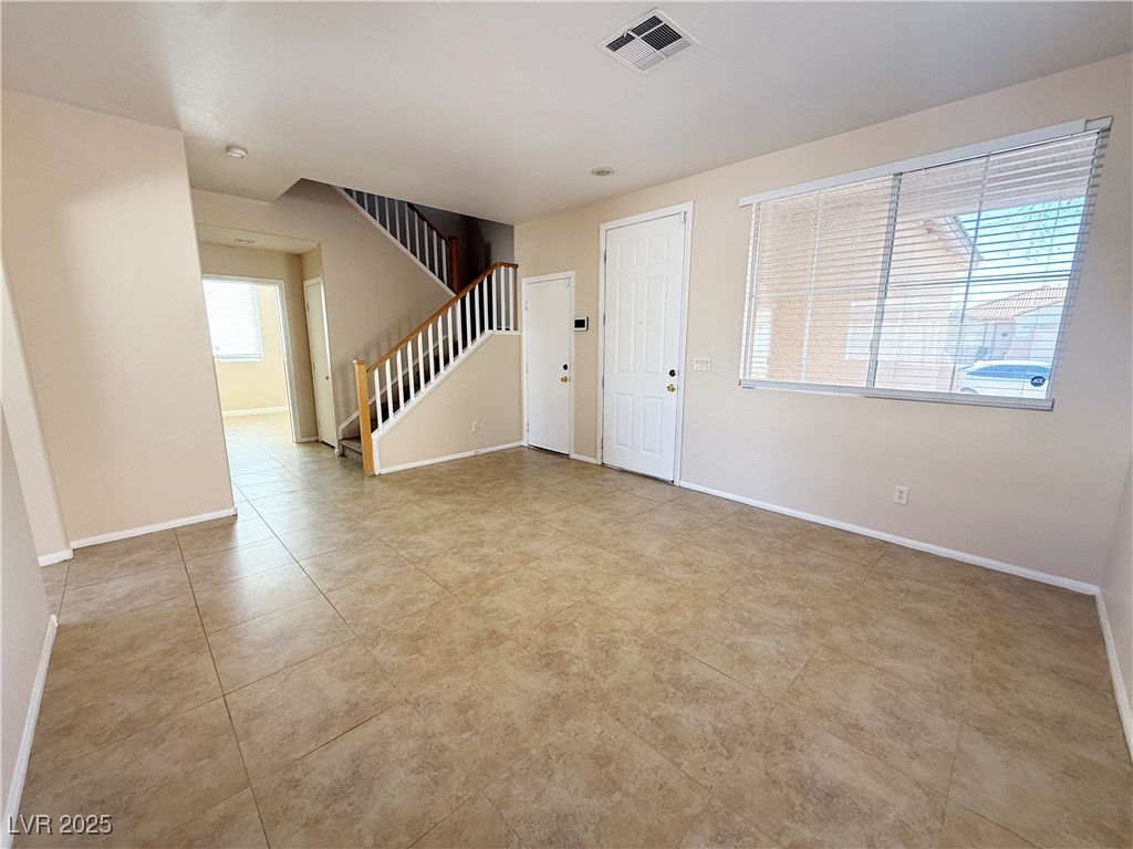 9950 Shadow Grove Avenue Las Vegas, NV 89148 - Photo 6 of 37 Entryway featuring stairway and light tile patterned floors