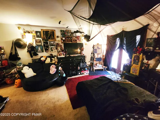 a white toilet sitting next to a bathroom sink and a mirror