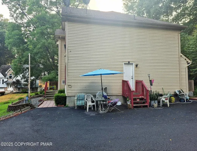 a view of stairs and with furniture