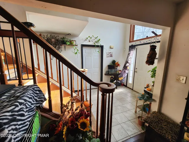 a living room with furniture a rug and a flat screen tv