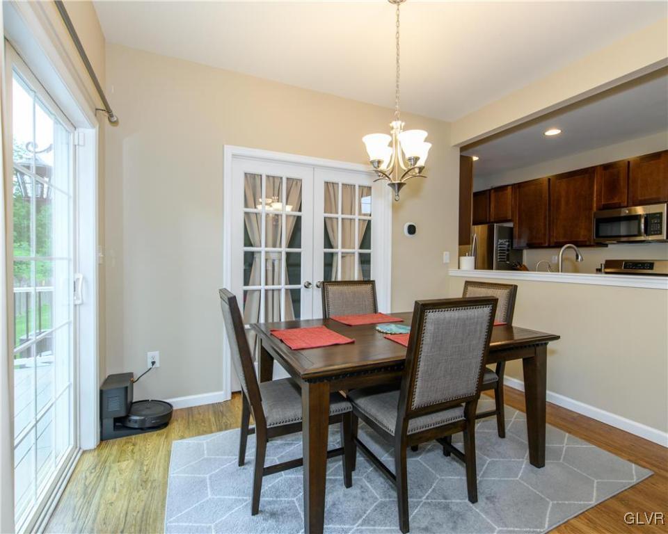 512 Racite Road Alburtis, PA 18011 - Photo 11 of 32 a dining room with furniture a chandelier and wooden floor