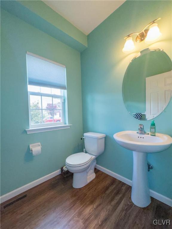 512 Racite Road Alburtis, PA 18011 - Photo 12 of 32 a bathroom with a toilet sink and mirror