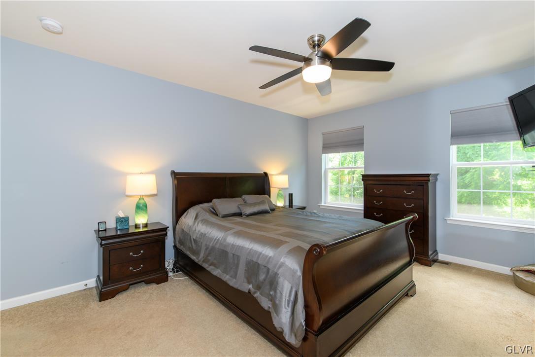 512 Racite Road Alburtis, PA 18011 - Photo 14 of 32 a bedroom with a bed and window