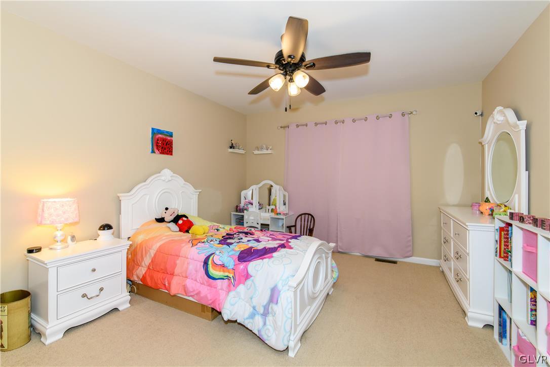 512 Racite Road Alburtis, PA 18011 - Photo 20 of 32 a bedroom with a bed and a ceiling fan