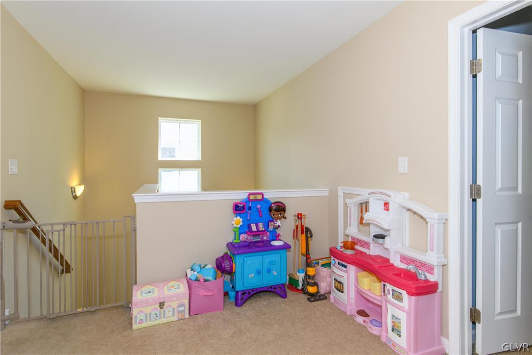 512 Racite Road Alburtis, PA 18011 - Photo 22 of 32 a bedroom with baby toys and dresser