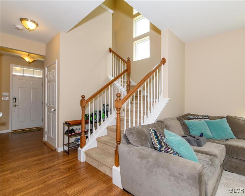 512 Racite Road Alburtis, PA 18011 - Photo 3 of 32 a view of a livingroom with wooden floor and stairs