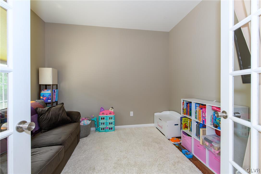 512 Racite Road Alburtis, PA 18011 - Photo 5 of 32 a living room with furniture and a flat screen tv