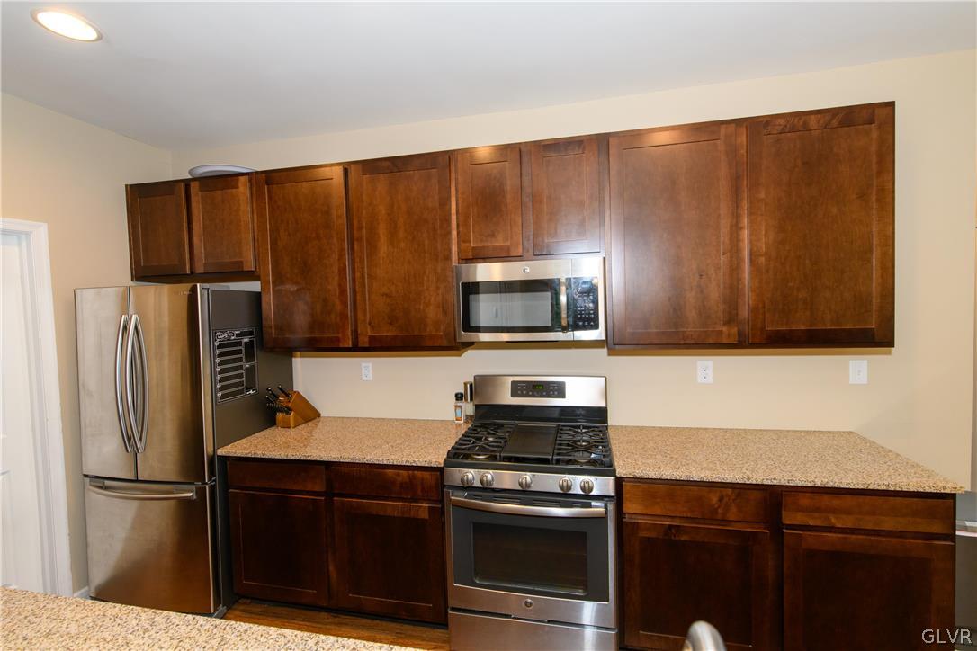 512 Racite Road Alburtis, PA 18011 - Photo 9 of 32 a kitchen with a refrigerator stove and microwave