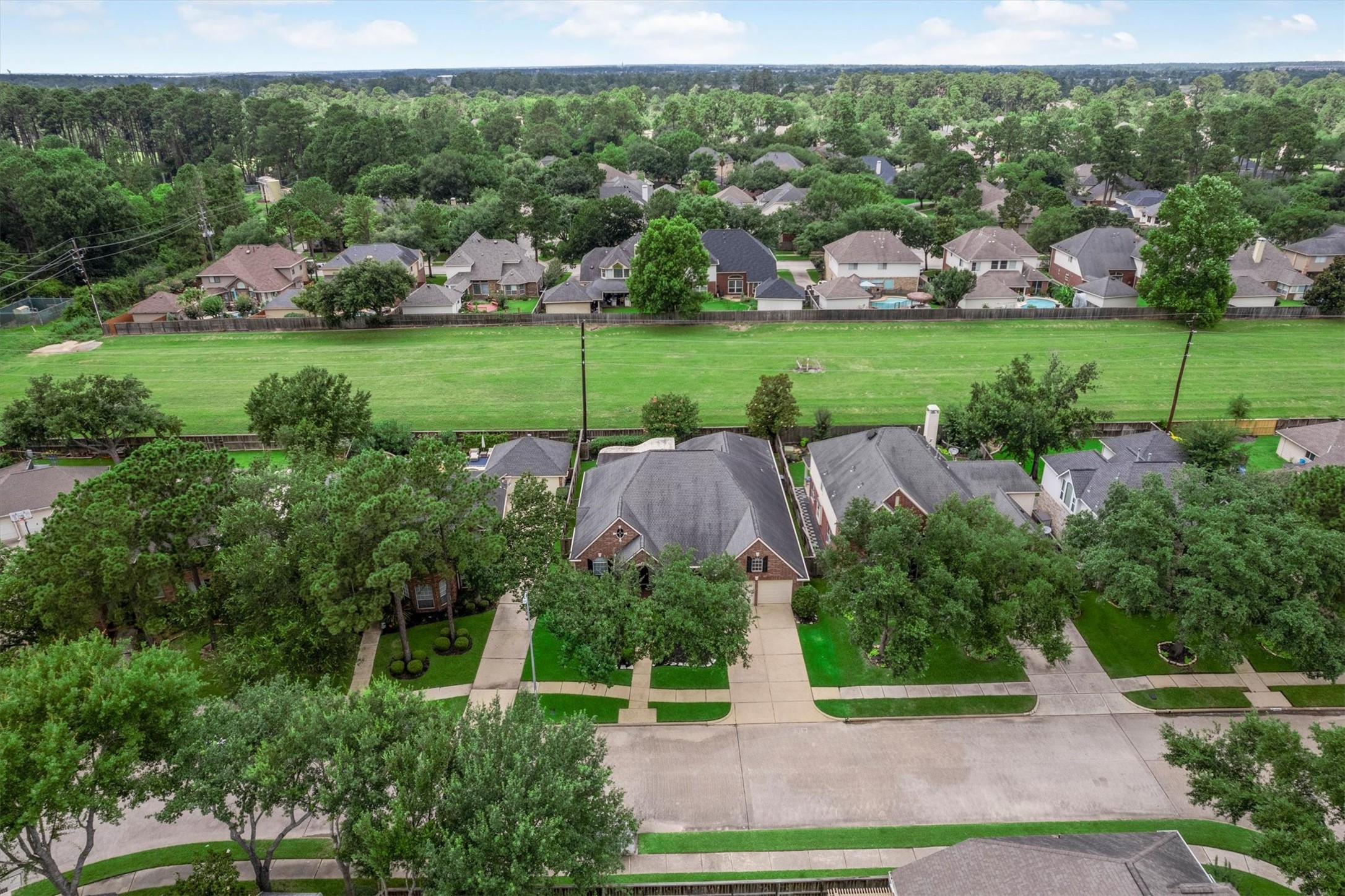 9406 Lochflora Drive Spring, TX 77379 - Photo 38 of 49 an aerial view of a house with a yard