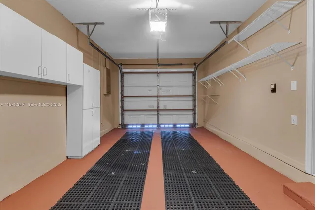 a view of a bathroom from a corridor