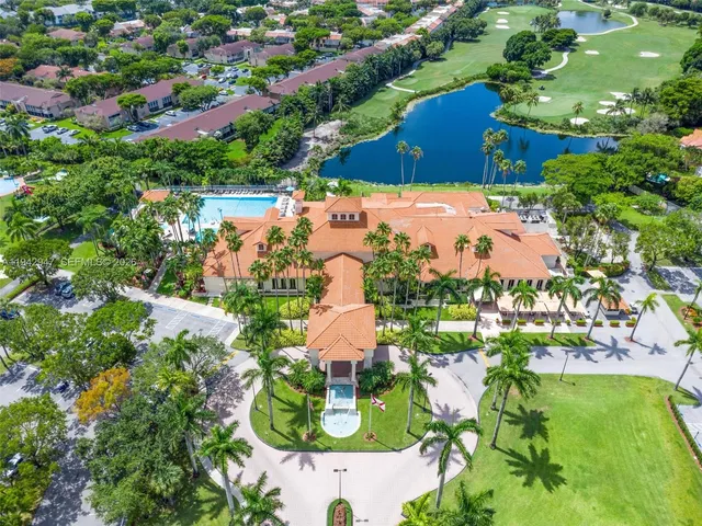 an aerial view of residential house with outdoor space and swimming pool