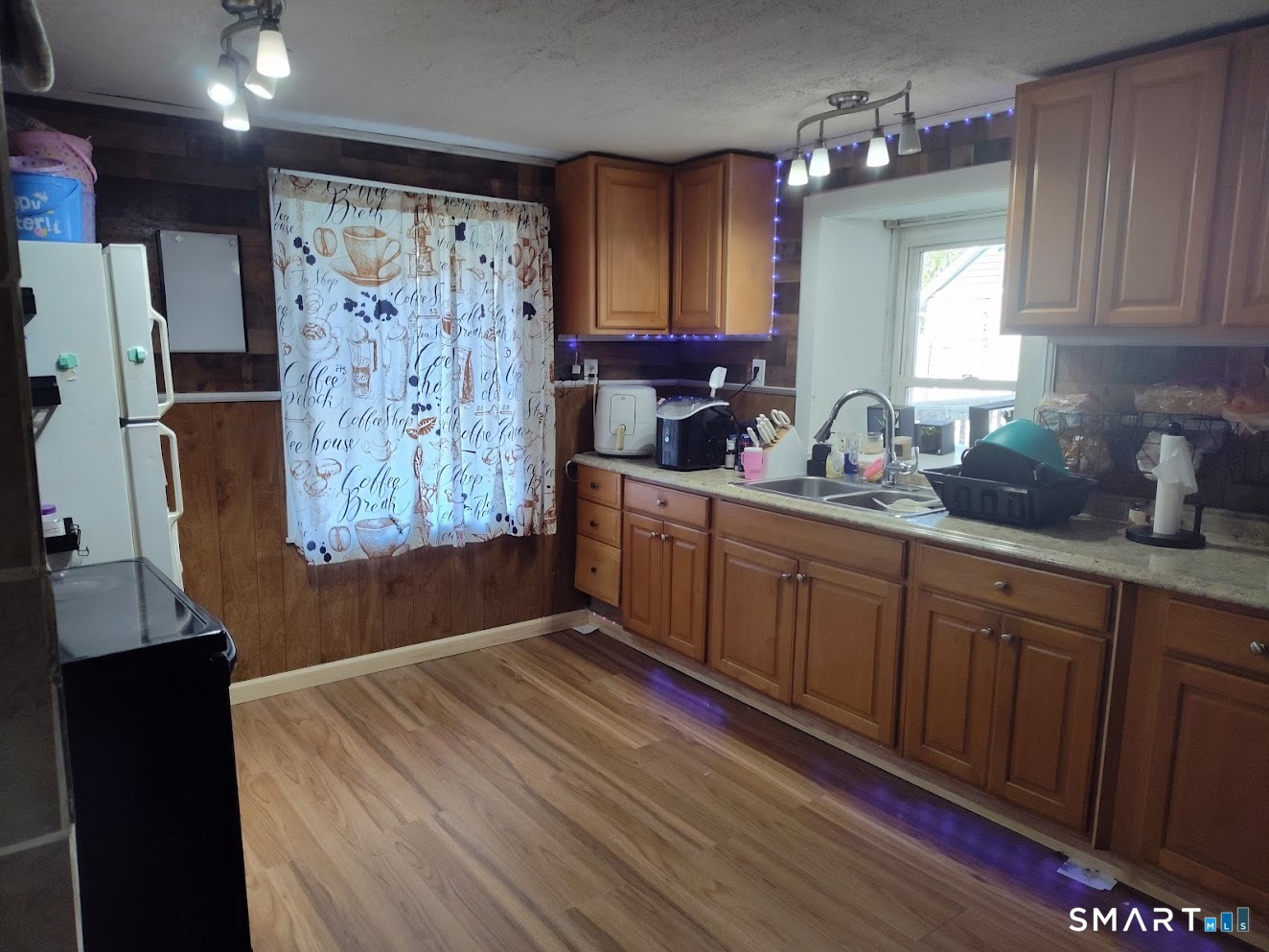 13 Rose Street Norwich, CT 06360 - Photo 7 of 21 a kitchen with stainless steel appliances a refrigerator sink and cabinets