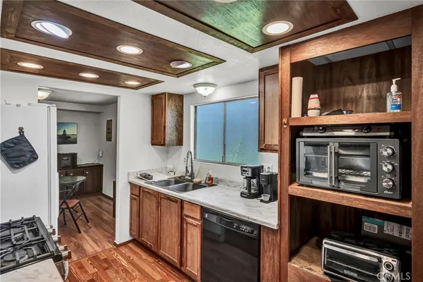 a kitchen with stainless steel appliances a stove and a microwave