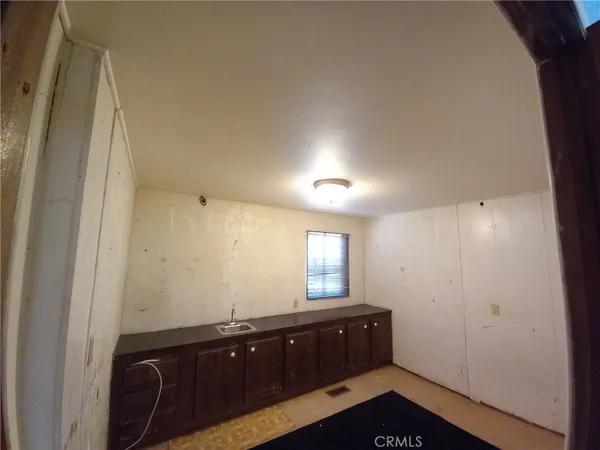 a room with a sink and a mirror