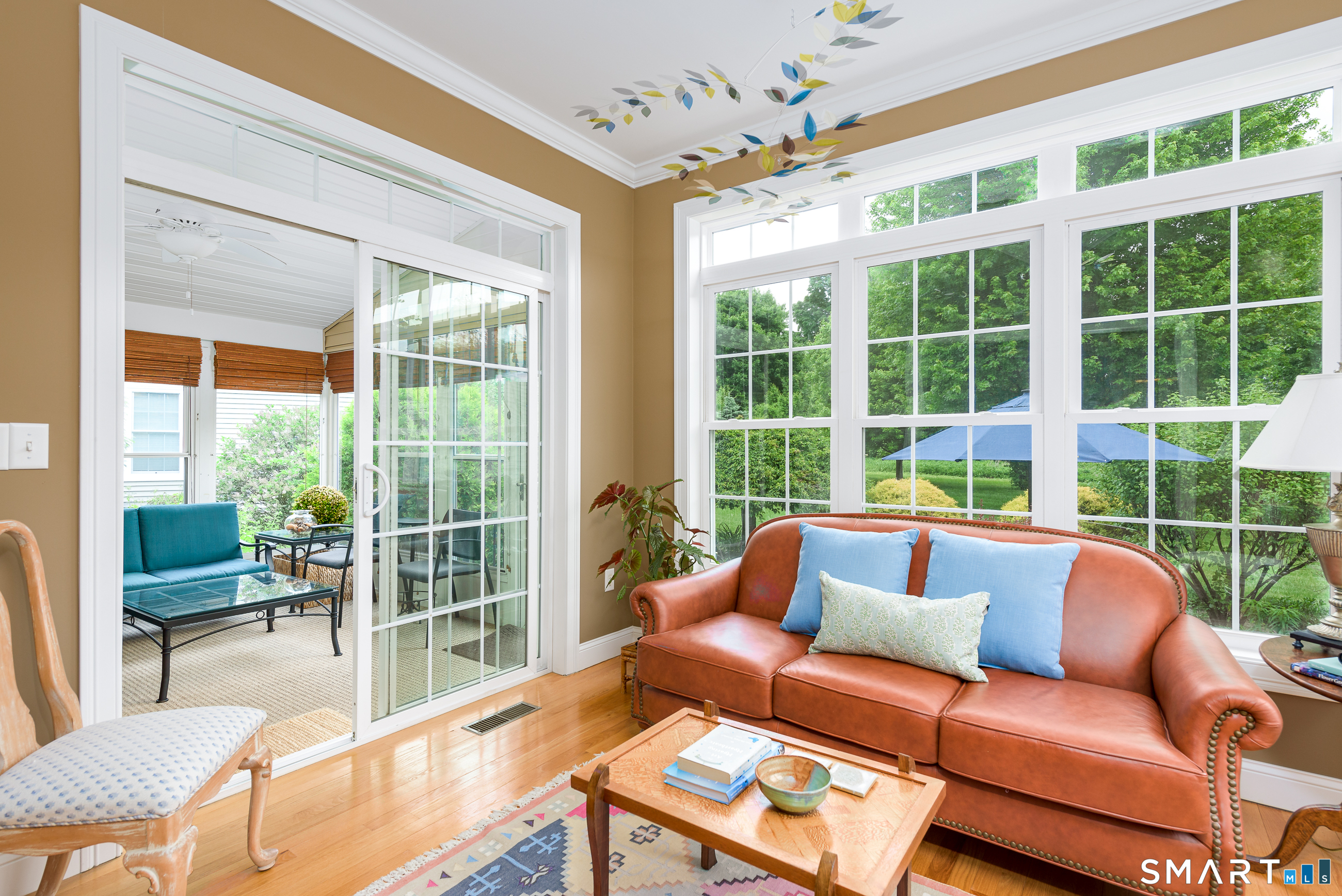 8 Greendale Drive, Unit 8 Suffield, CT 06078 - Photo 12 of 40 a living room with furniture and a large window