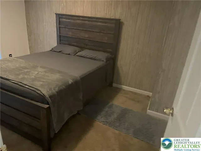 a bedroom with a bed and a cabinets