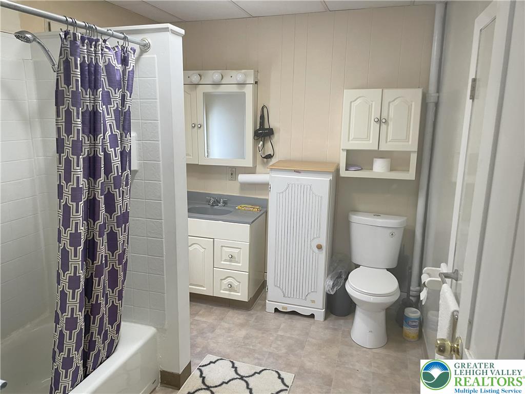104 Washington Street Bath, PA 18014 - Photo 9 of 20 a bathroom with a granite countertop sink toilet and shower