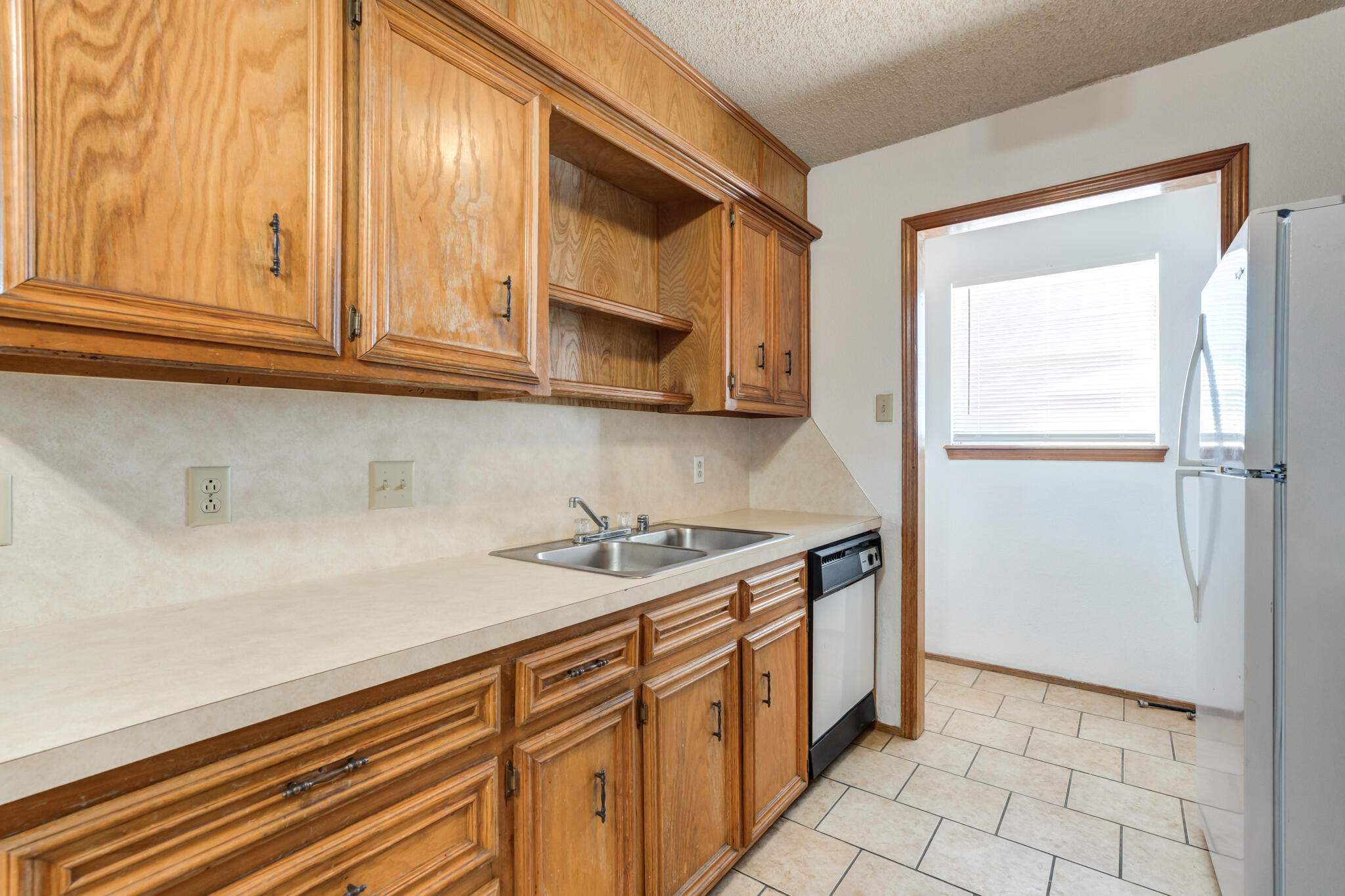 7405 Waco Avenue Lubbock, TX 79423 - Photo 19 of 29 a kitchen with stainless steel appliances granite countertop a sink and a cabinets