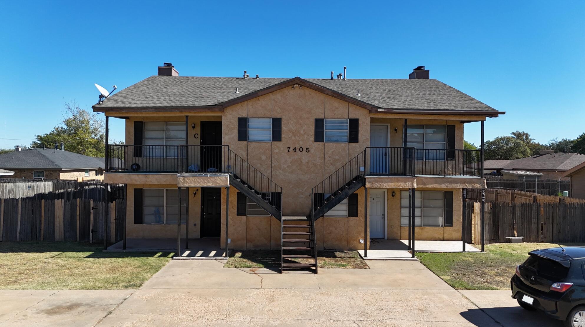 7405 Waco Avenue Lubbock, TX 79423 - Photo 2 of 29 a front view of a house with yard