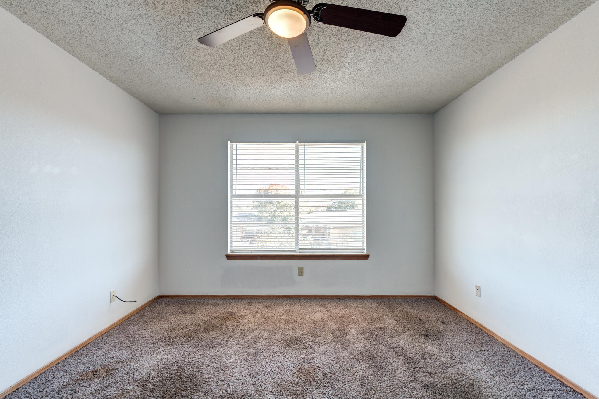 7405 Waco Avenue Lubbock, TX 79423 - Photo 28 of 29 an empty room with a window