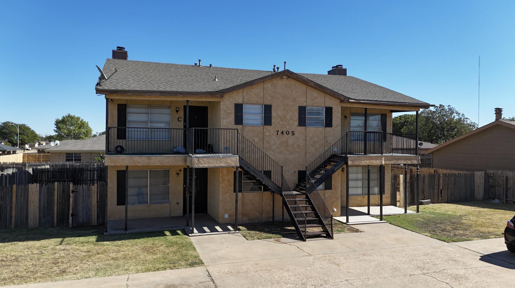 7405 Waco Avenue Lubbock, TX 79423 - Photo 3 of 29 a front view of a house with garden