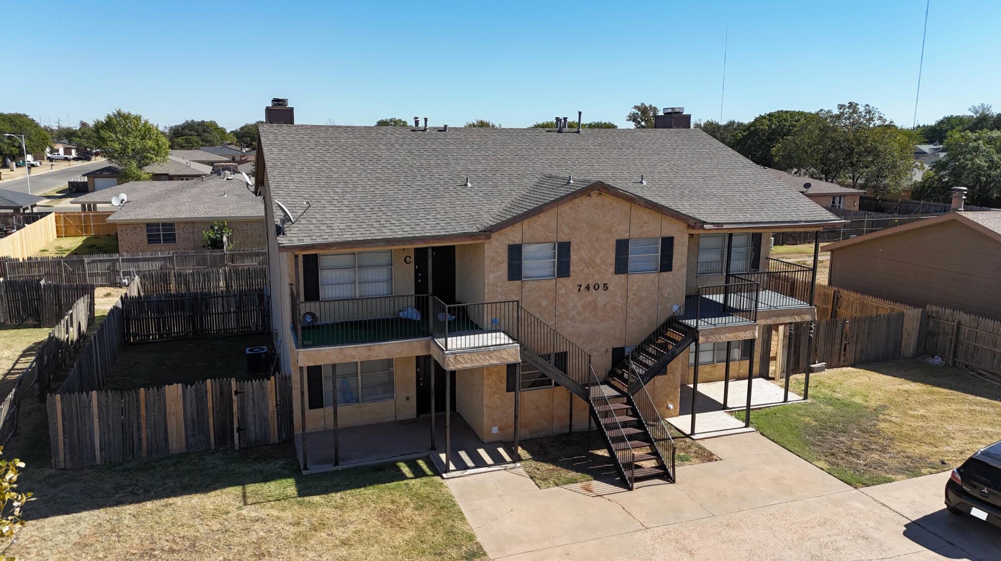 7405 Waco Avenue Lubbock, TX 79423 - Photo 4 of 29 a view of a house with roof deck front of house