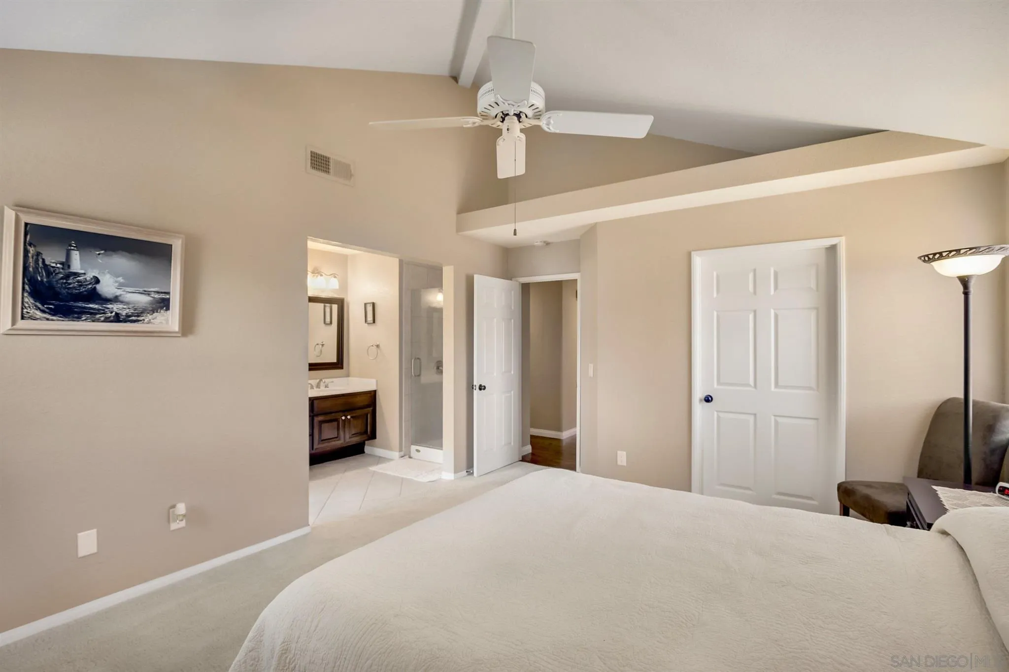 1753 Harold Road Escondido, CA 92026 - Photo 16 of 28 a bedroom with a bed and a chandelier