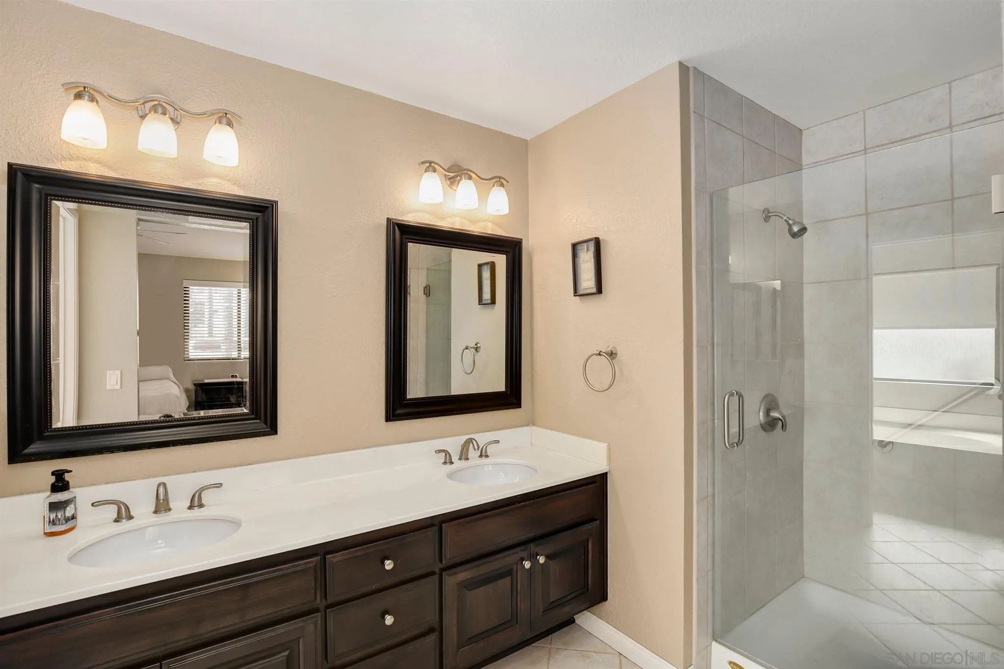 1753 Harold Road Escondido, CA 92026 - Photo 17 of 28 a bathroom with double vanity sink a mirror and a shower