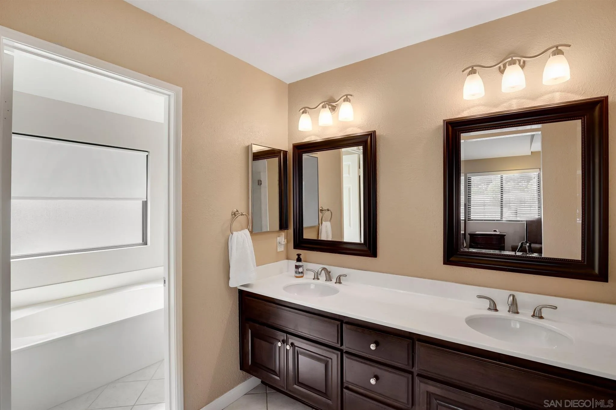 1753 Harold Road Escondido, CA 92026 - Photo 18 of 28 a bathroom with 2 sink and a mirror